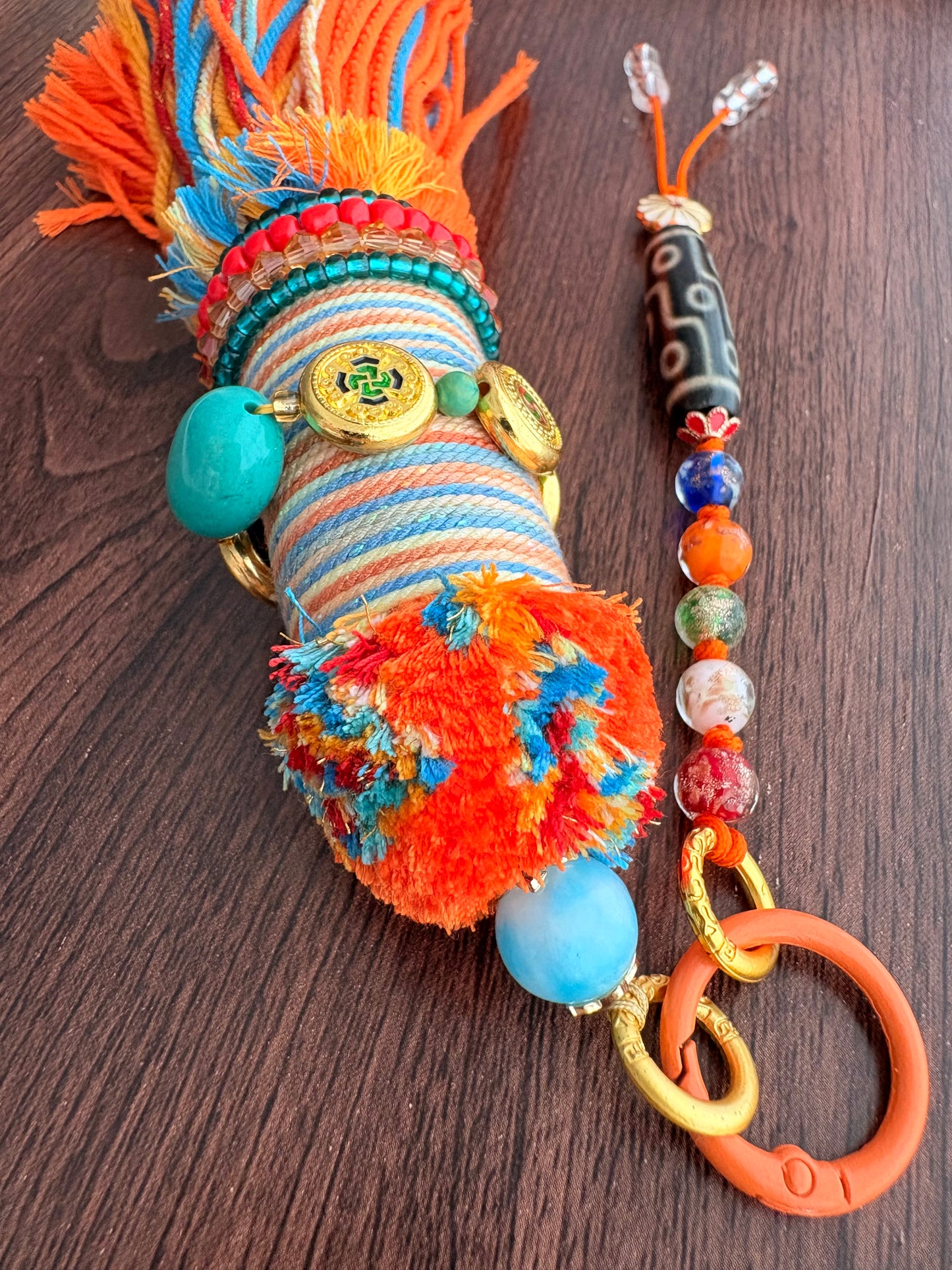 Victory Banner Charm with Nine-Eyed Dzi Bead Tassel in Tibetan Orange