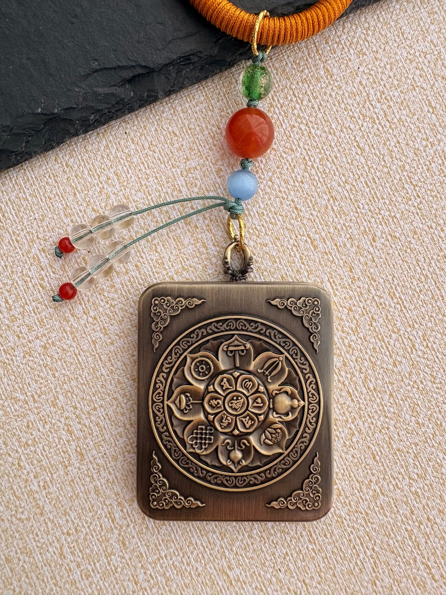 Mahakala Thangka Charm with Prayer Wheel Tassel in Tibetan Brown