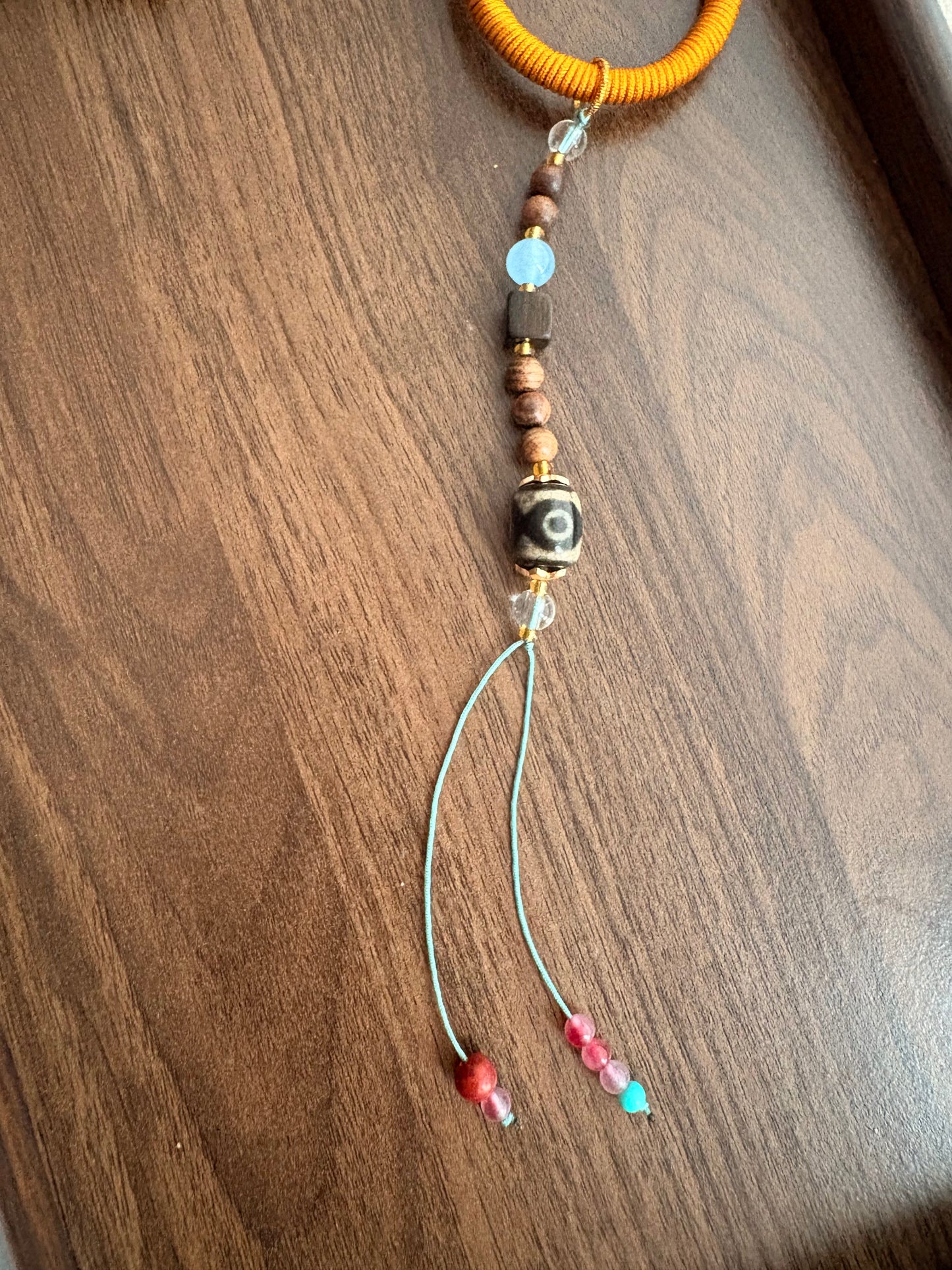 Mahakala Thangka Charm with Three-Eyed Agate Dzi Bead Tassel in Tibetan Brown