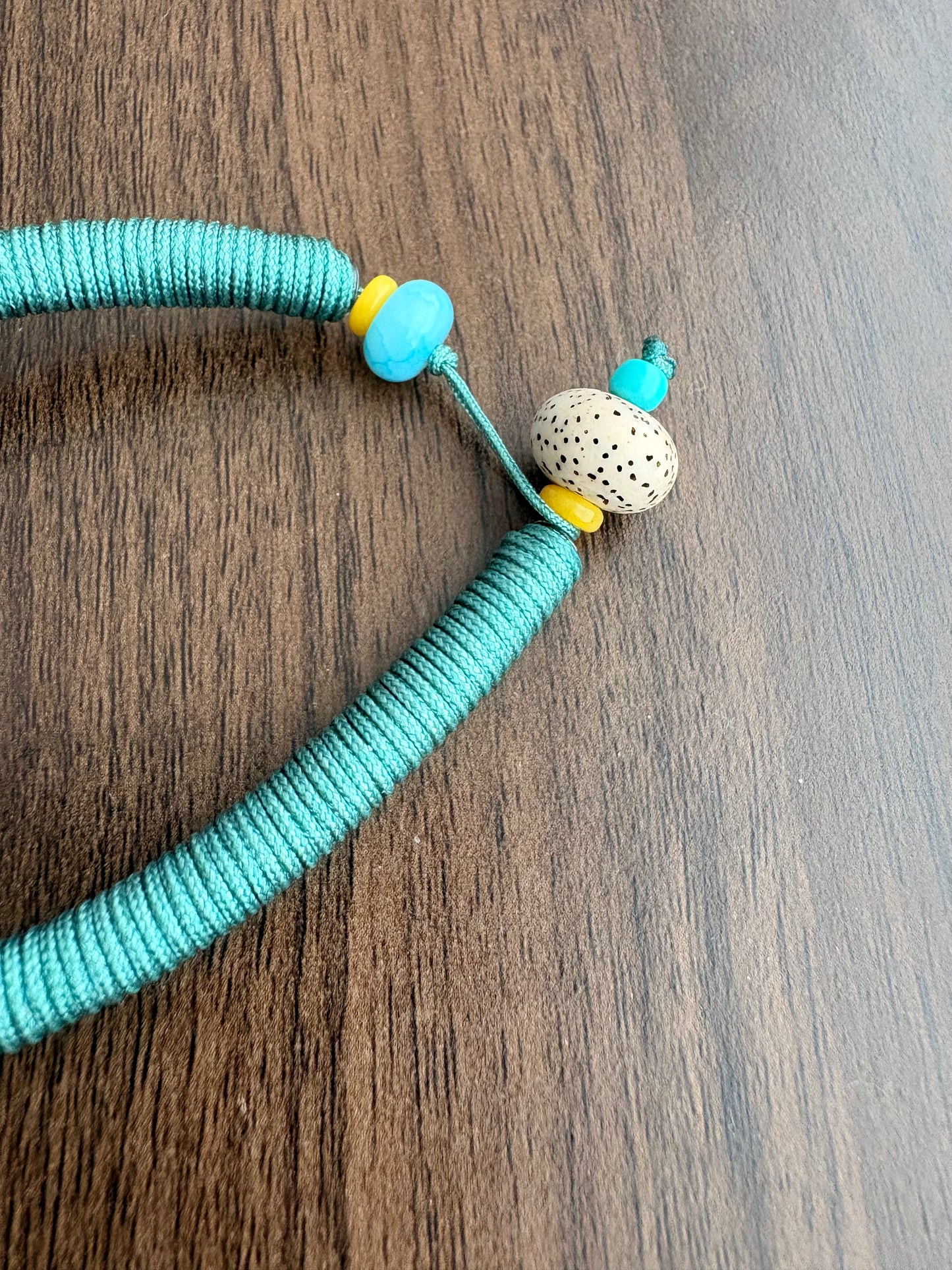 Medicine Buddha Thangka Charm with Prayer Wheel Tassel in Tibetan Green