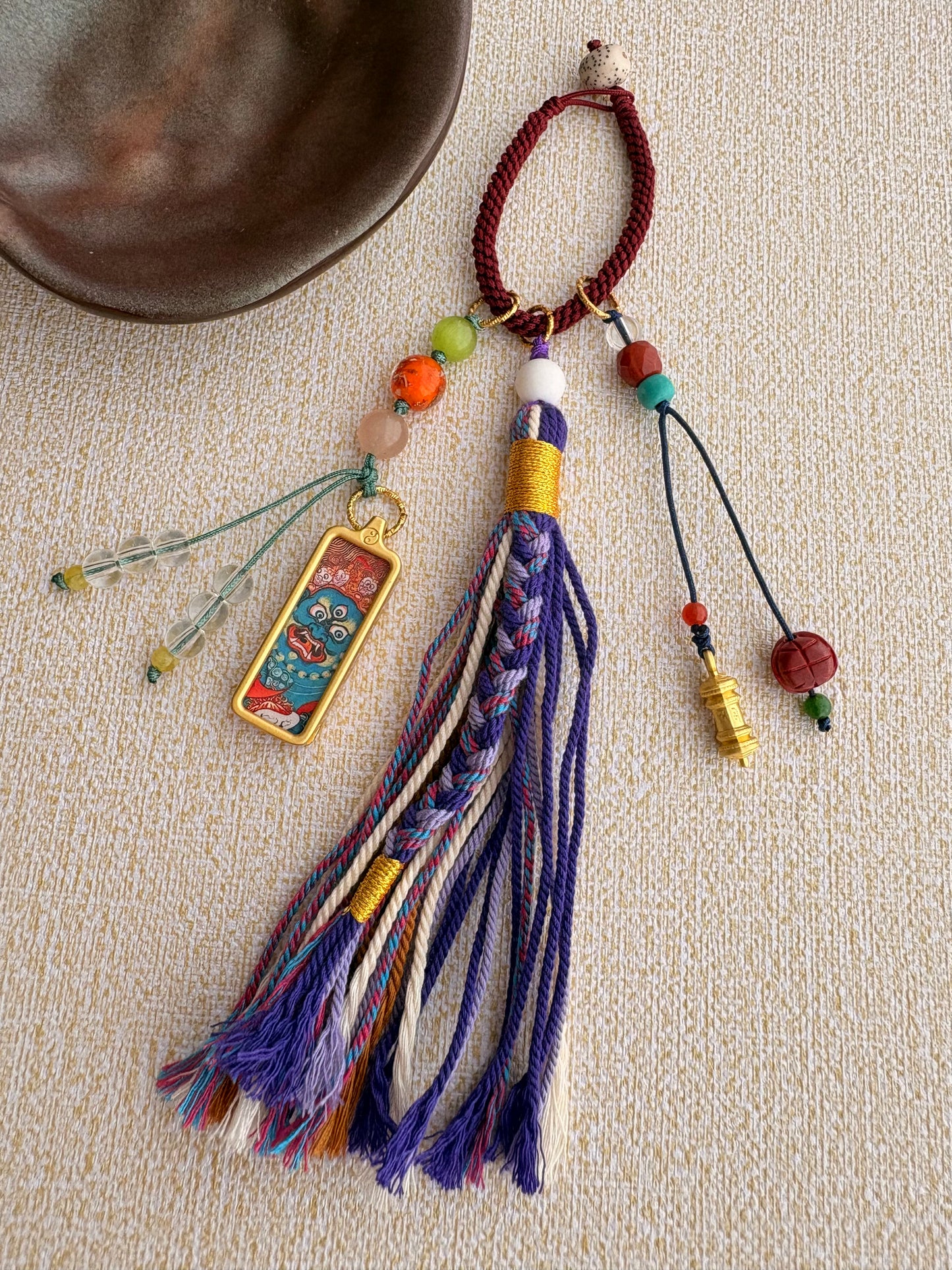 Small Mahakala Thangka Charm with Prayer Wheel Tassel in Tibetan Purple