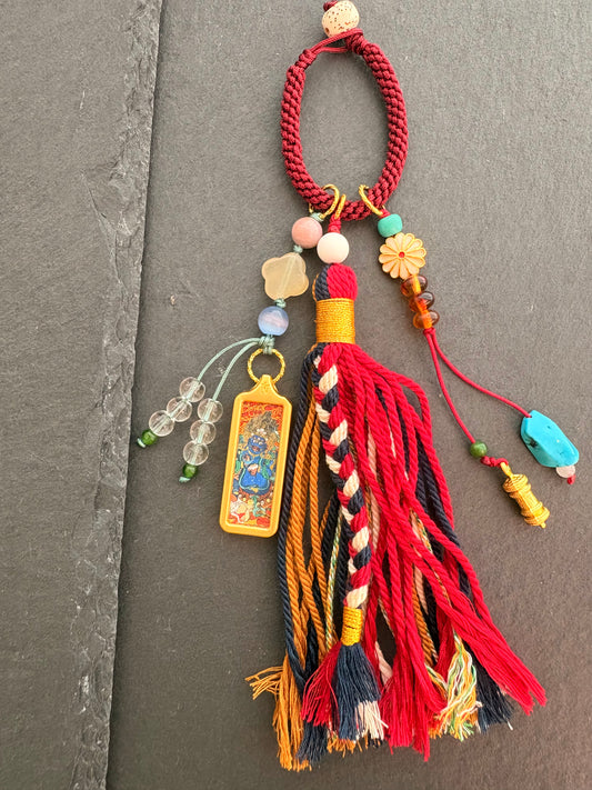 Small Mahakala Thangka Charm with Prayer Wheel Tassel in Tibetan Red