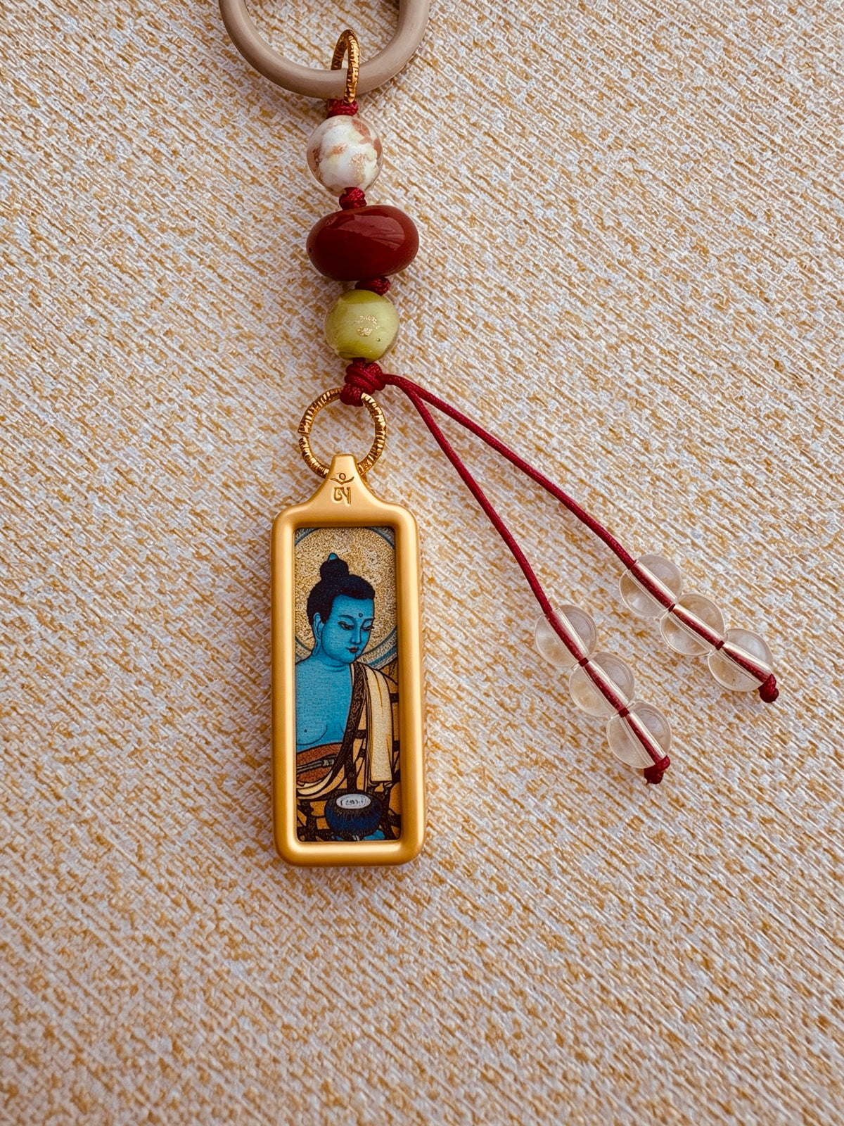 Small Victory Banner Charm with Medicine Buddha Thangka Tassel in Tibetan Red