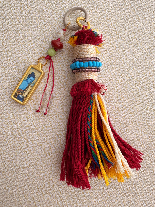 Small Victory Banner Charm with Medicine Buddha Thangka Tassel in Tibetan Red