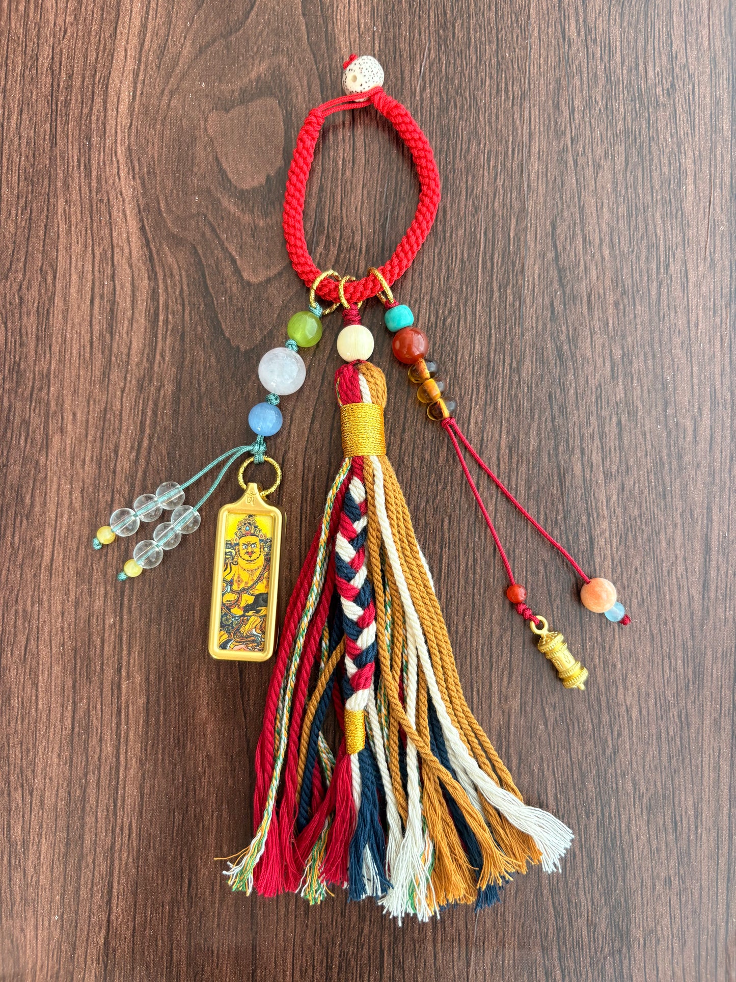 Small Yellow Jambhala Thangka Charm with Prayer Wheel Charm in Tibetan Red and Brown