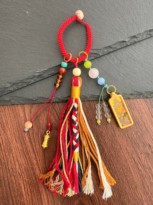 Small Yellow Jambhala Thangka Charm with Prayer Wheel Charm in Tibetan Red and Brown