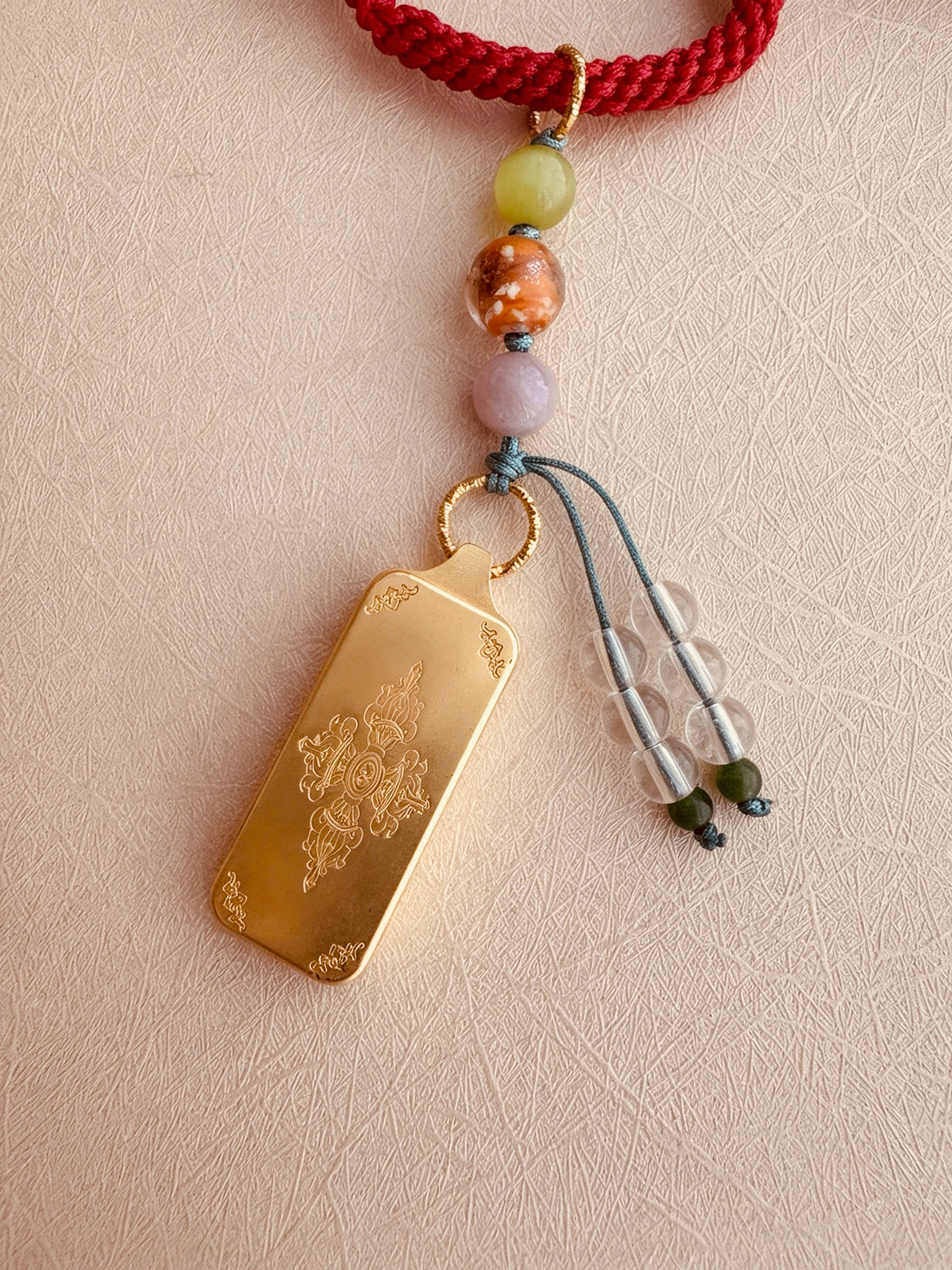 Small Yellow Jambhala Thangka Charm with Prayer Wheel and Flower Charm in Tibetan Red