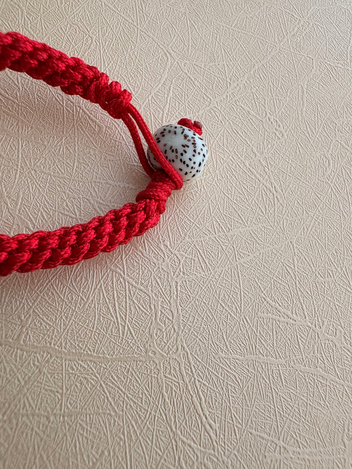 Small Yellow Jambhala Thangka Charm with Prayer Wheel and Flower Charm in Tibetan Red
