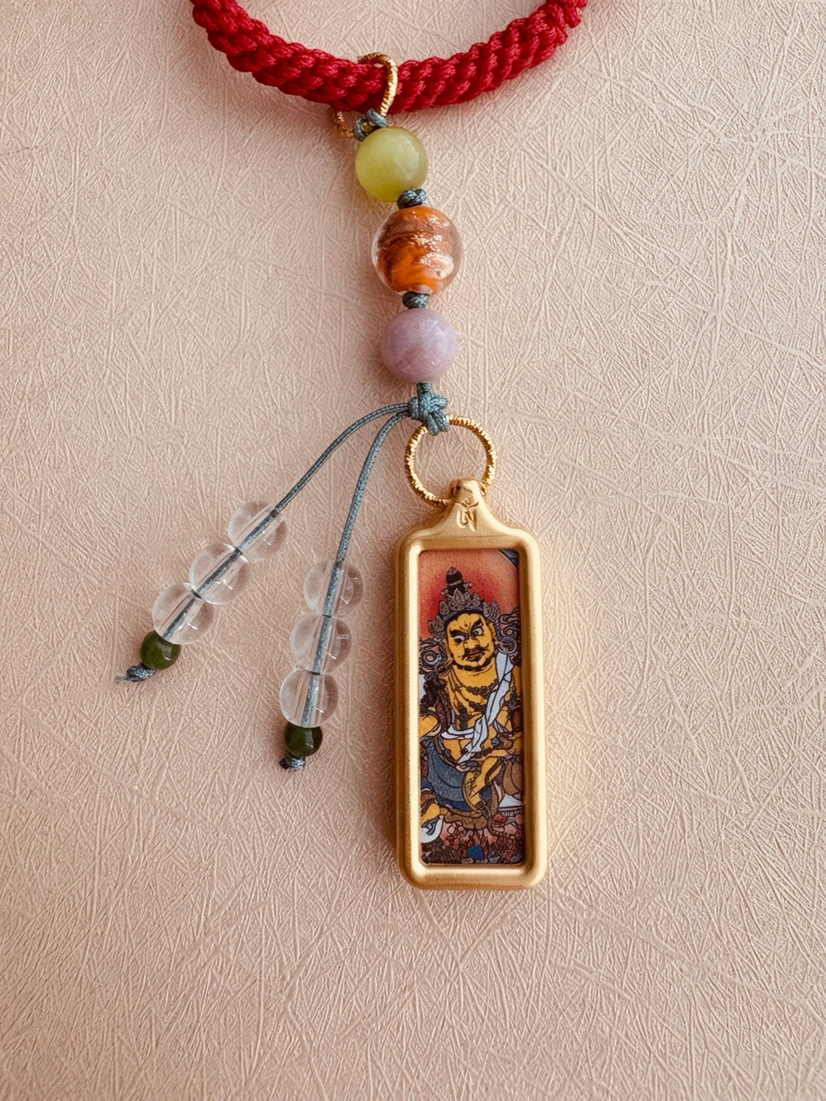 Small Yellow Jambhala Thangka Charm with Prayer Wheel and Flower Charm in Tibetan Red