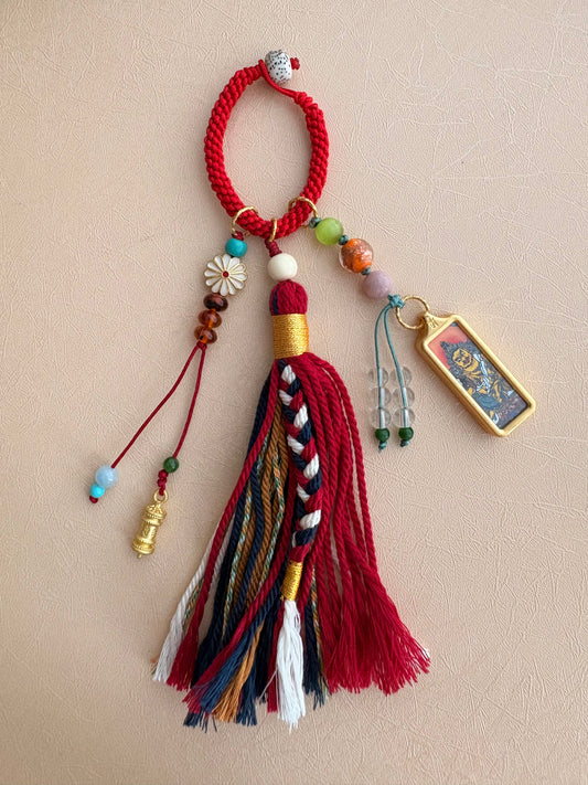Small Yellow Jambhala Thangka Charm with Prayer Wheel and Flower Charm in Tibetan Red