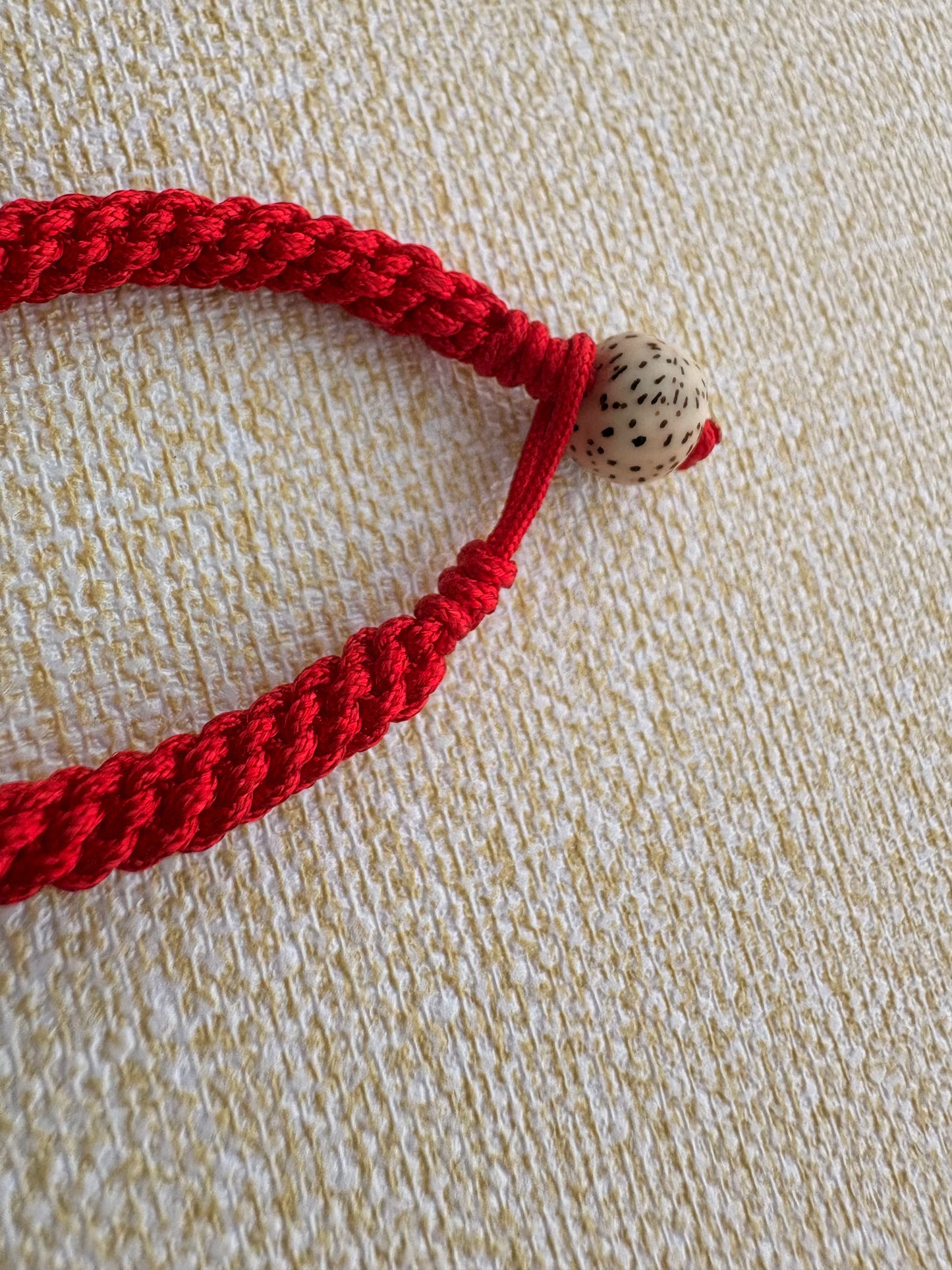 Small Yellow Jambhala Thangka Charm with Prayer Wheel Charm in Tibetan Red