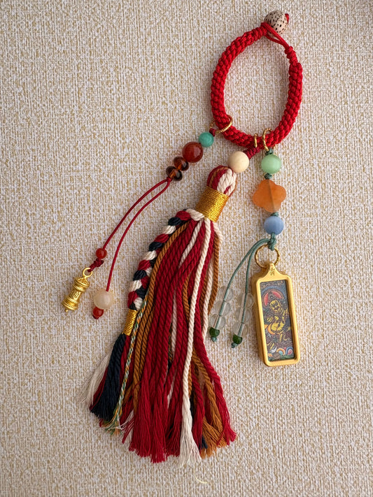 Small Yellow Jambhala Thangka Charm with Prayer Wheel Charm in Tibetan Red