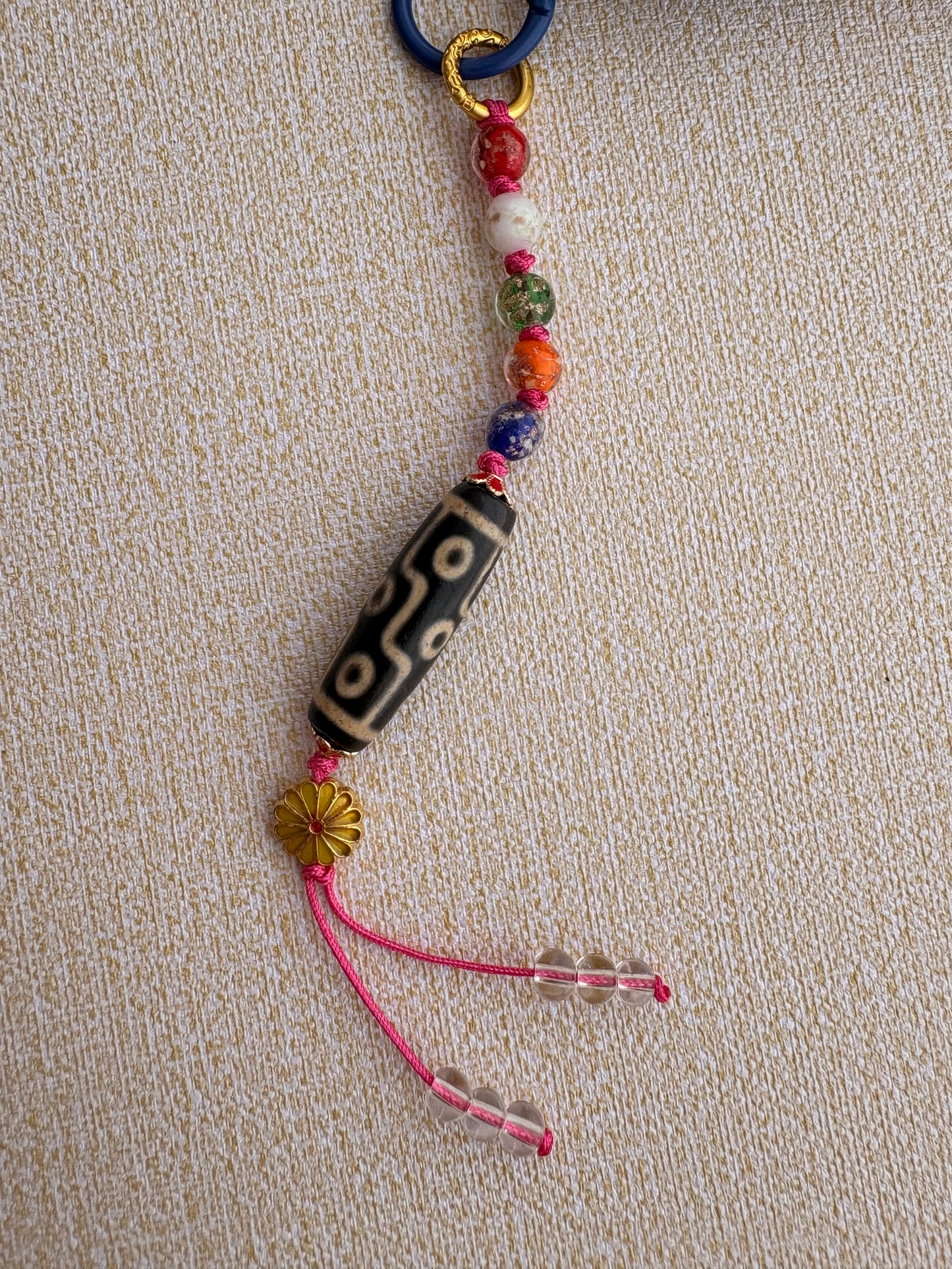 Victory Banner Charm with Nine-Eyed Dzi Bead Tassel in deep Tibetan Blue