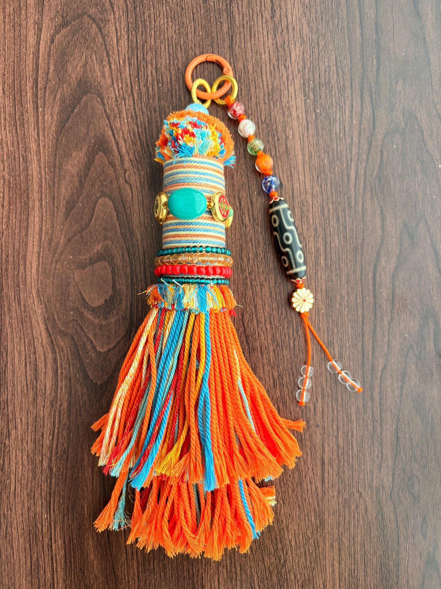 Victory Banner Charm with Nine-Eyed Dzi Bead Tassel in Tibetan Orange