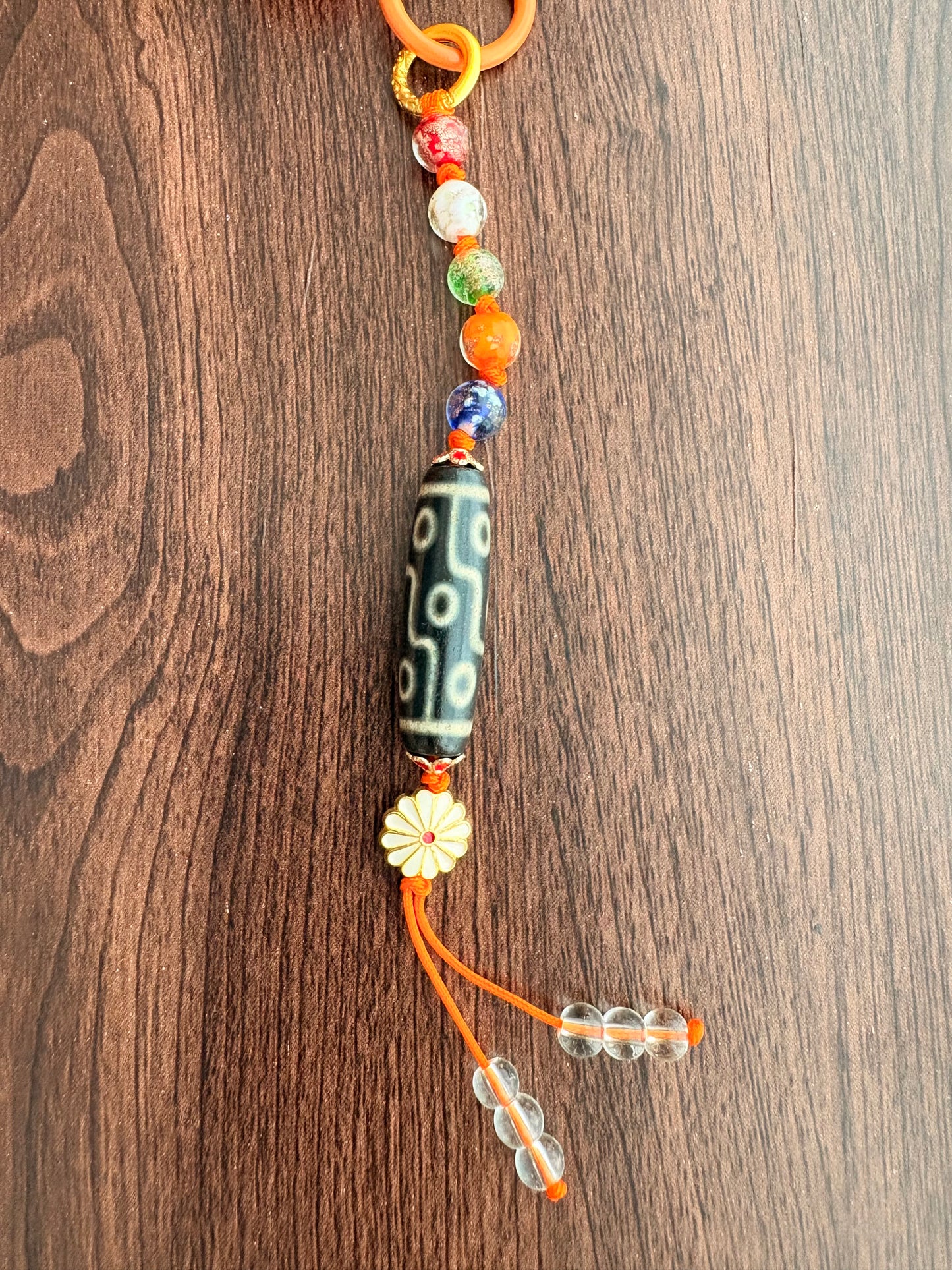 Victory Banner Charm with Nine-Eyed Dzi Bead Tassel in Tibetan Orange