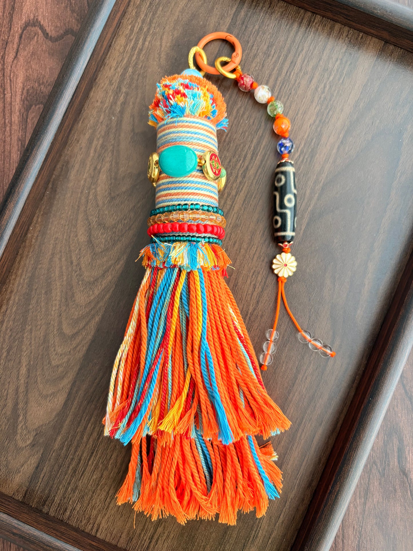 Victory Banner Charm with Nine-Eyed Dzi Bead Tassel in Tibetan Orange