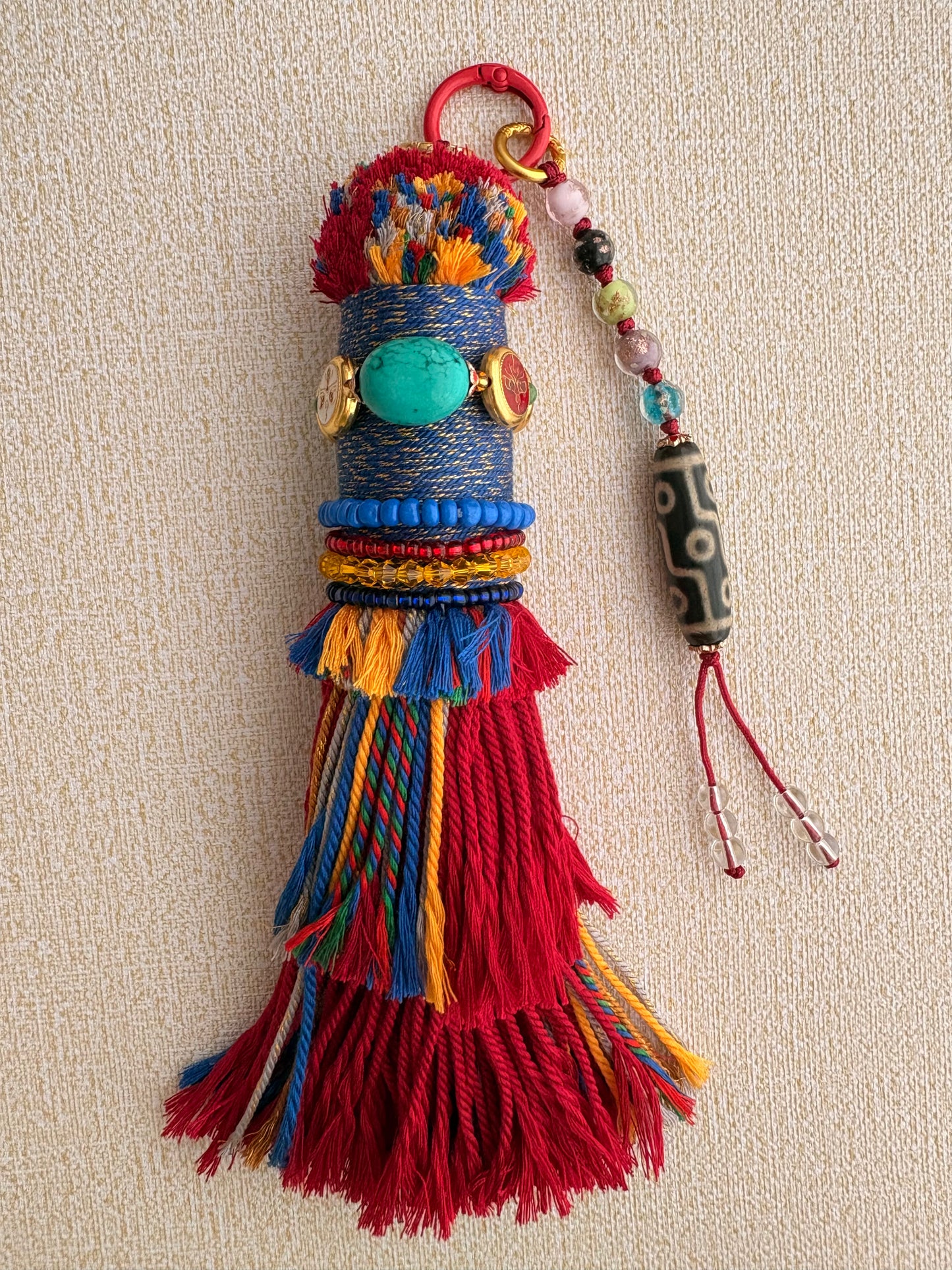 Victory Banner Charm with Nine-Eyed Dzi Bead Tassel in Tibetan Red and blue
