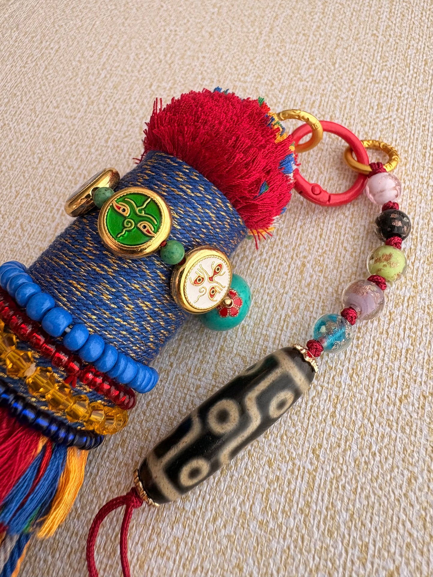 Victory Banner Charm with Nine-Eyed Dzi Bead Tassel in Tibetan Red and blue
