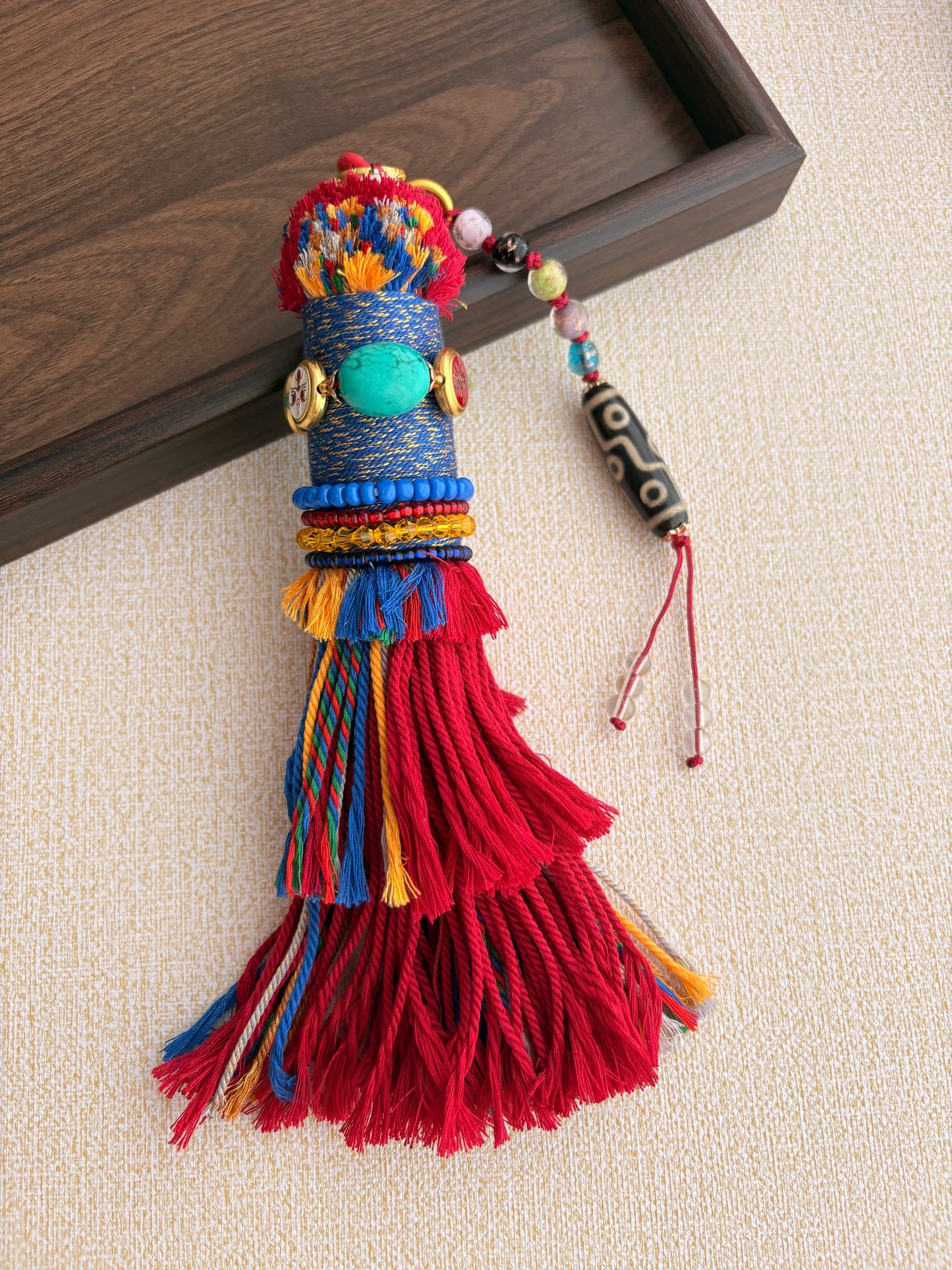 Victory Banner Charm with Nine-Eyed Dzi Bead Tassel in Tibetan Red and blue