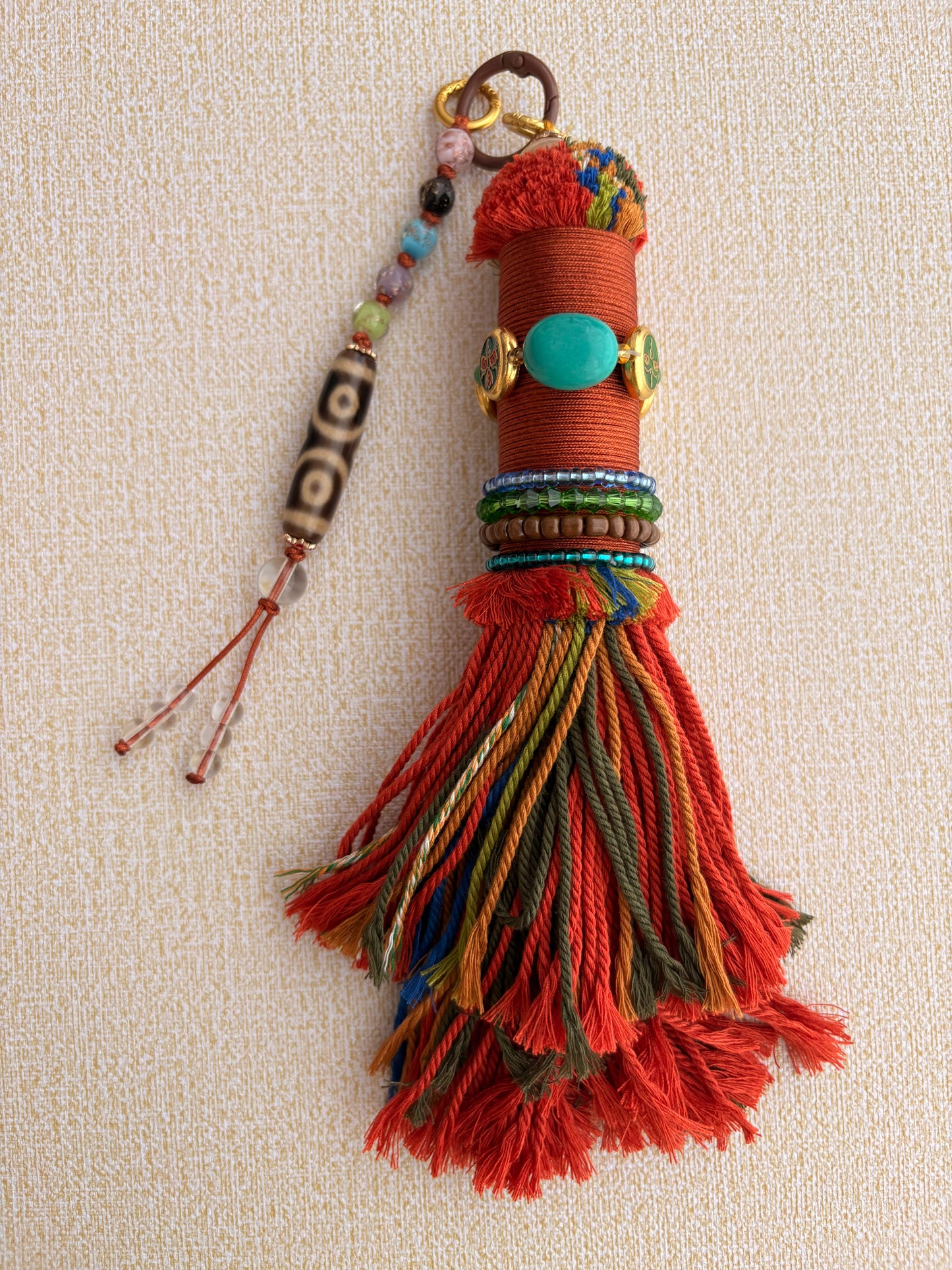Victory Banner Charm with Three-Eyed Dzi Bead Tassel in Tibetan Orange