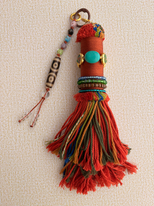 Victory Banner Charm with Three-Eyed Dzi Bead Tassel in Tibetan Orange