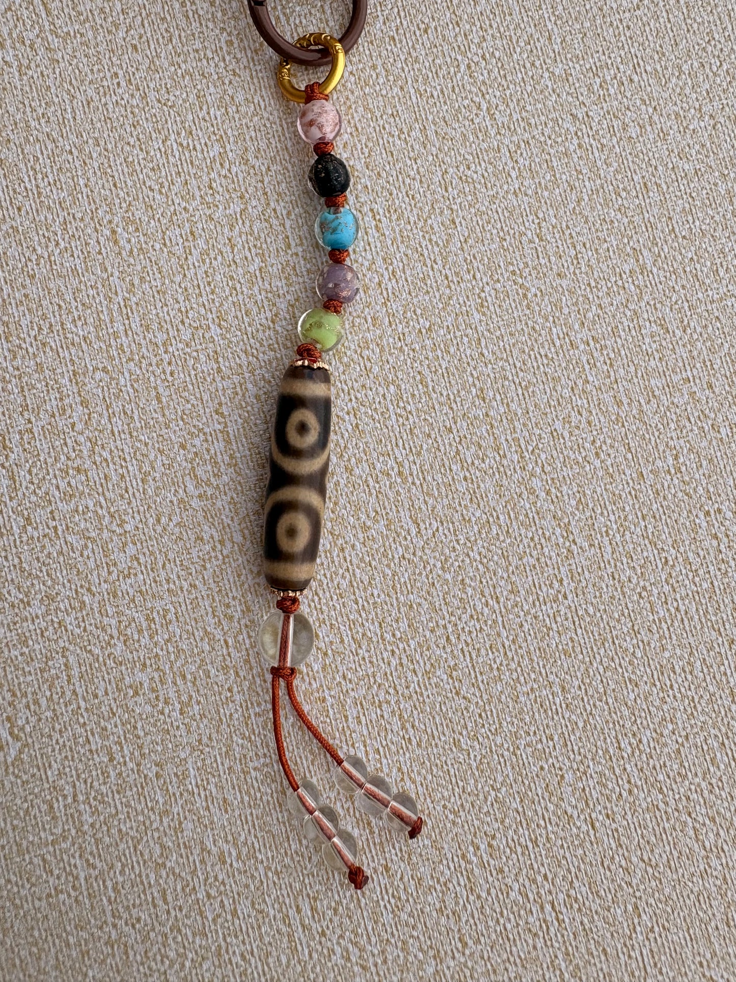 Victory Banner Charm with Three-Eyed Dzi Bead Tassel in Tibetan Orange