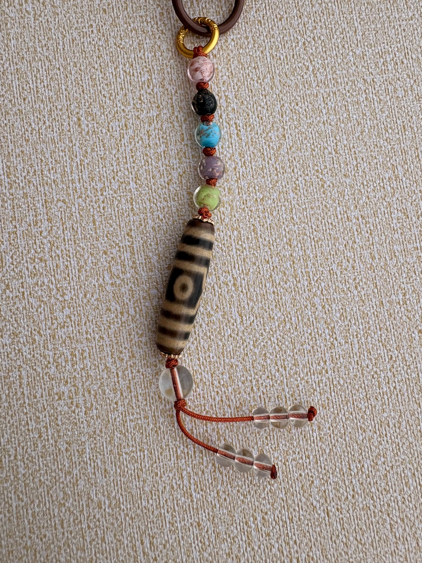 Victory Banner Charm with Three-Eyed Dzi Bead Tassel in Tibetan Orange