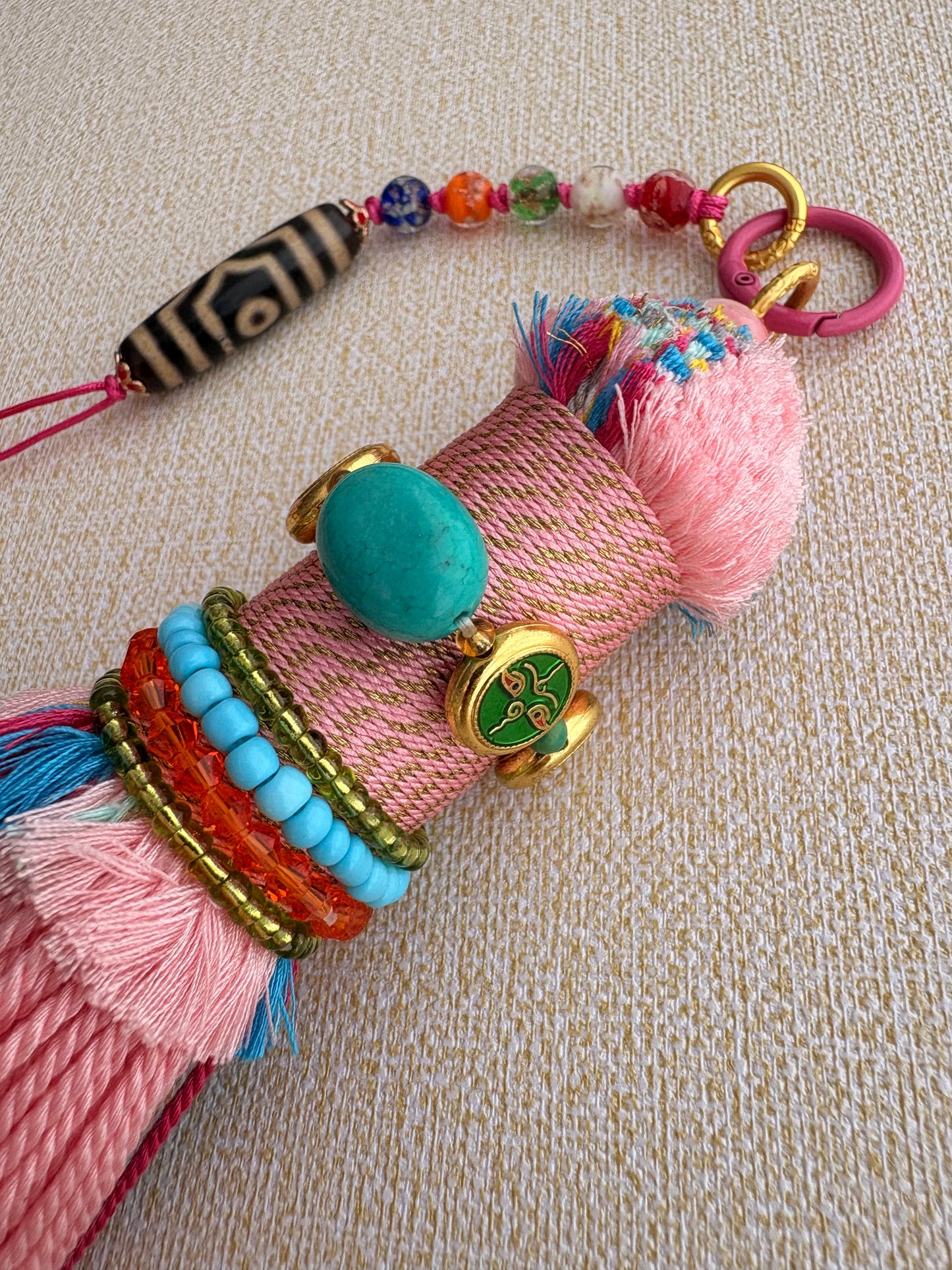 Victory Banner Charm with Three-Eyed Dzi Bead Tassel in Tibetan Pink