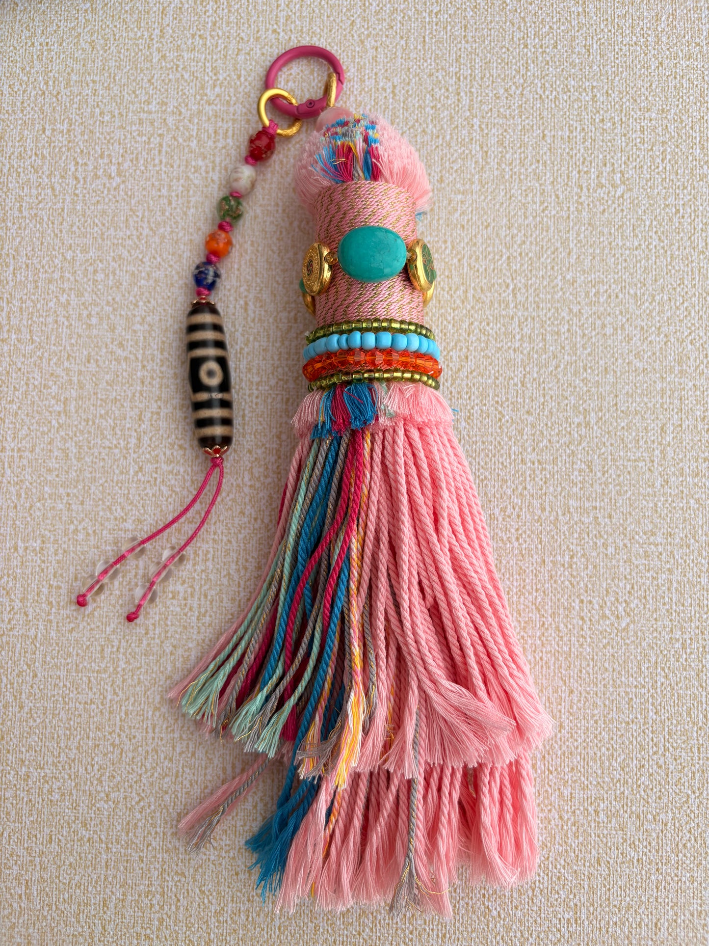 Victory Banner Charm with Three-Eyed Dzi Bead Tassel in Tibetan Pink