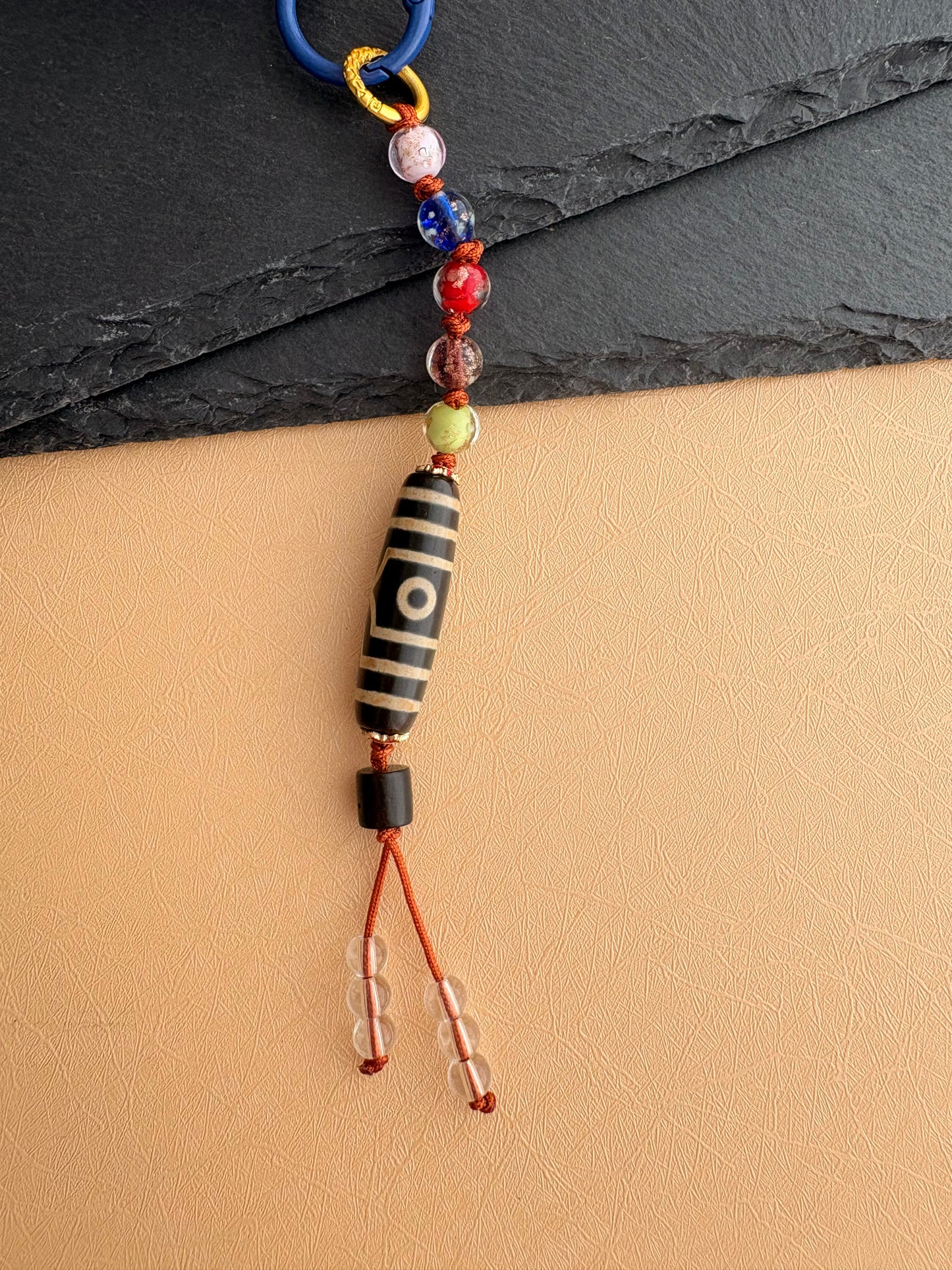 Victory Banner Charm with Three-Eyed Dzi Bead Tassel in Tibetan Purple
