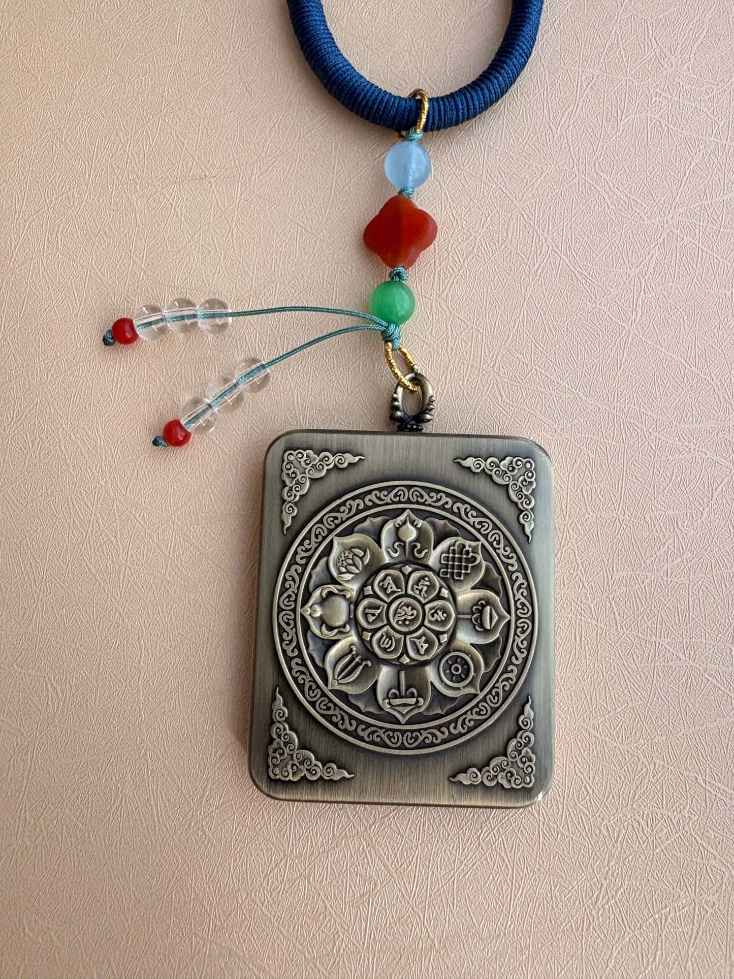 Yellow Jambhala Thangka Charm with Jade Tassel in Deep Tibetan Blue
