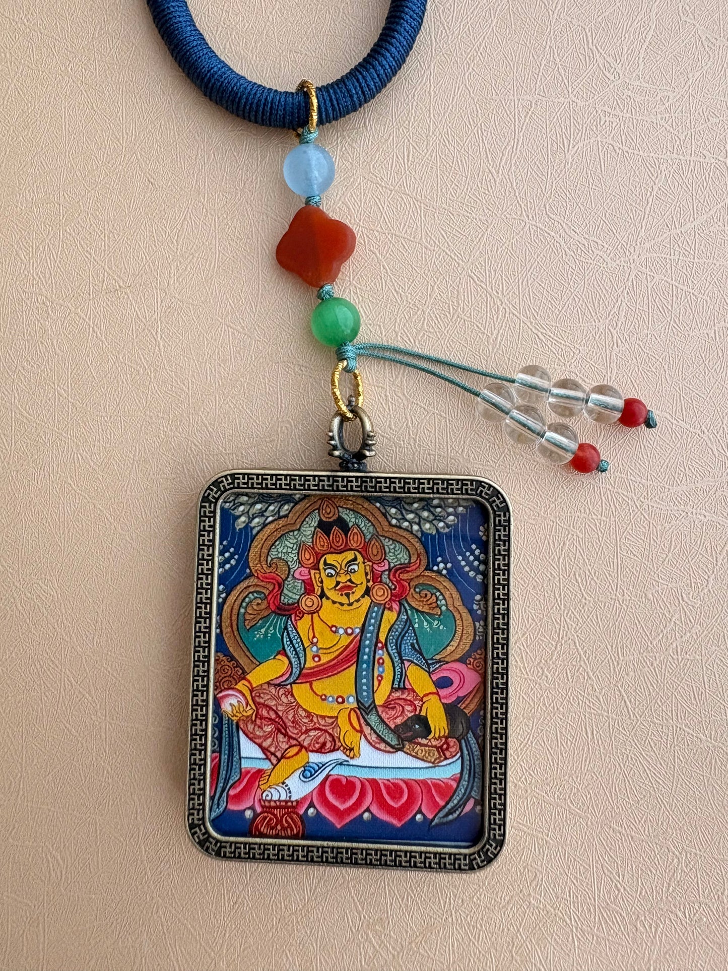 Yellow Jambhala Thangka Charm with Jade Tassel in Deep Tibetan Blue