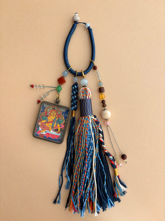 Yellow Jambhala Thangka Charm with Jade Tassel in Deep Tibetan Blue