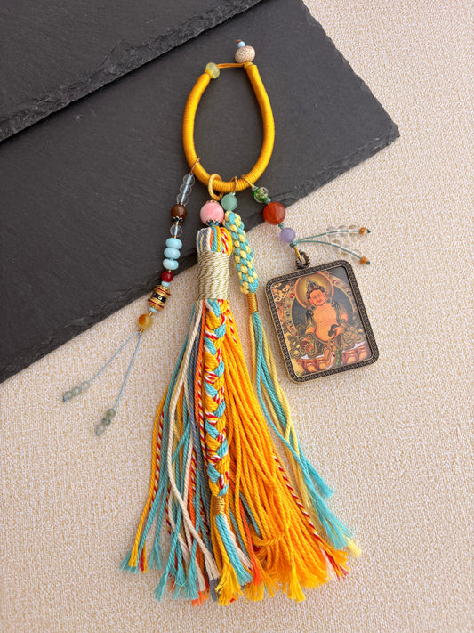 Yellow Jambhala Thangka Charm with Prayer Wheel Tassel in Tibetan Golden Yellow