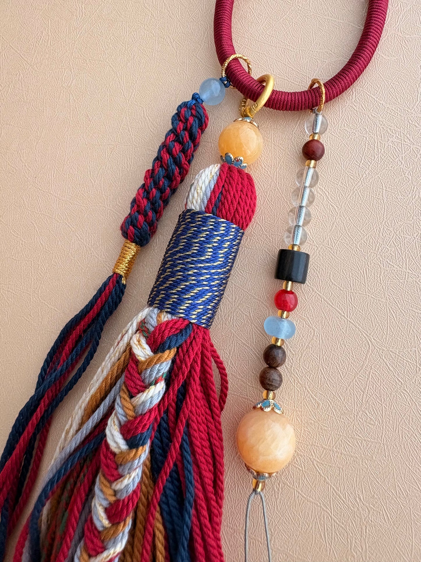 Zaki Lhamo Thangka Charm with Jade Tassel in Tibetan Red