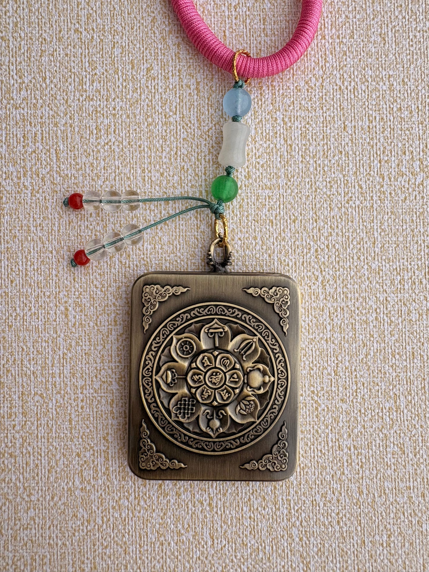 Zaki Lhamo Thangka Charm with Three-Eyed Dzi Bead Tassel in Tibetan Pink