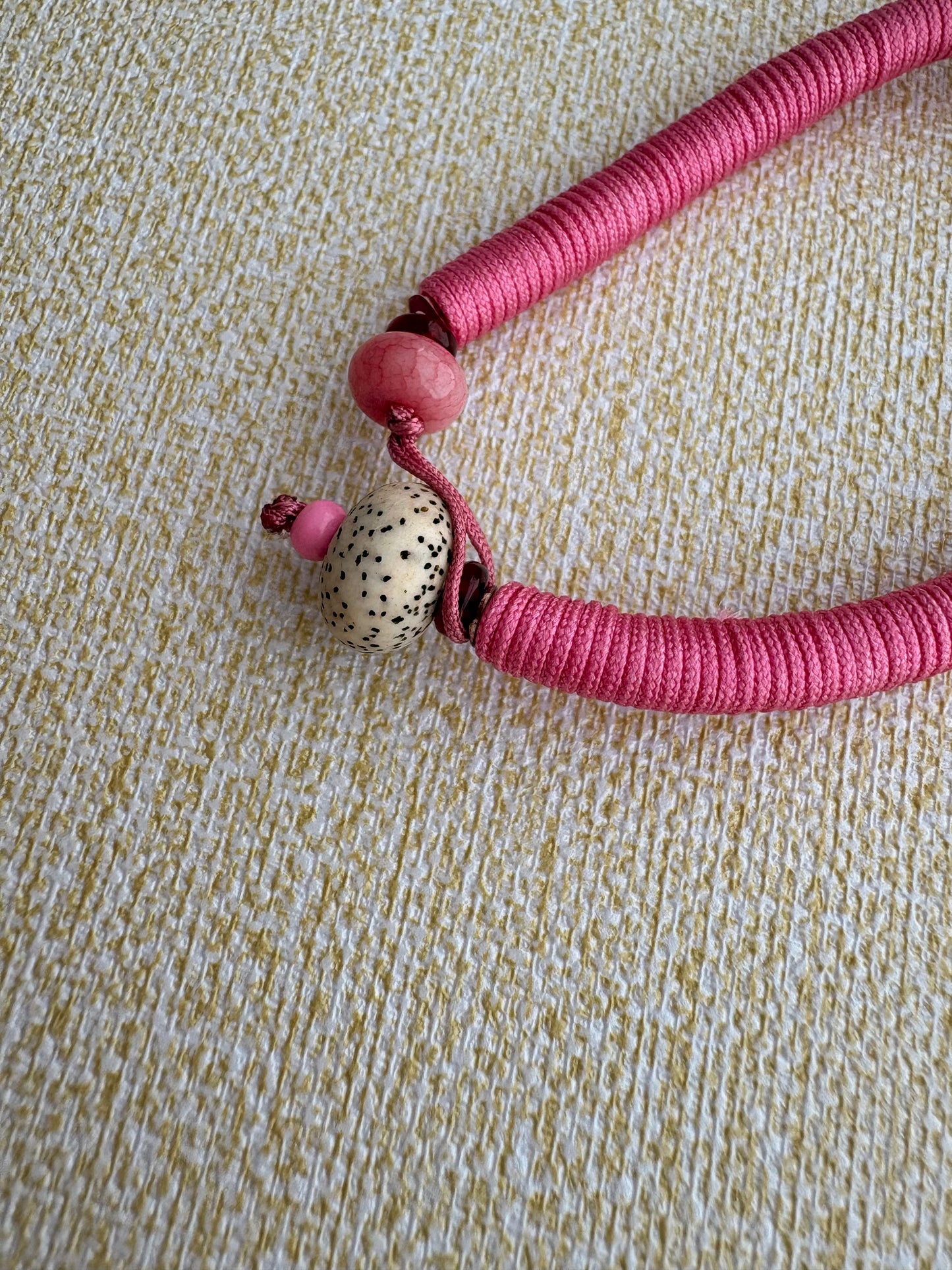 Zaki Lhamo Thangka Charm with Three-Eyed Dzi Bead Tassel in Tibetan Pink