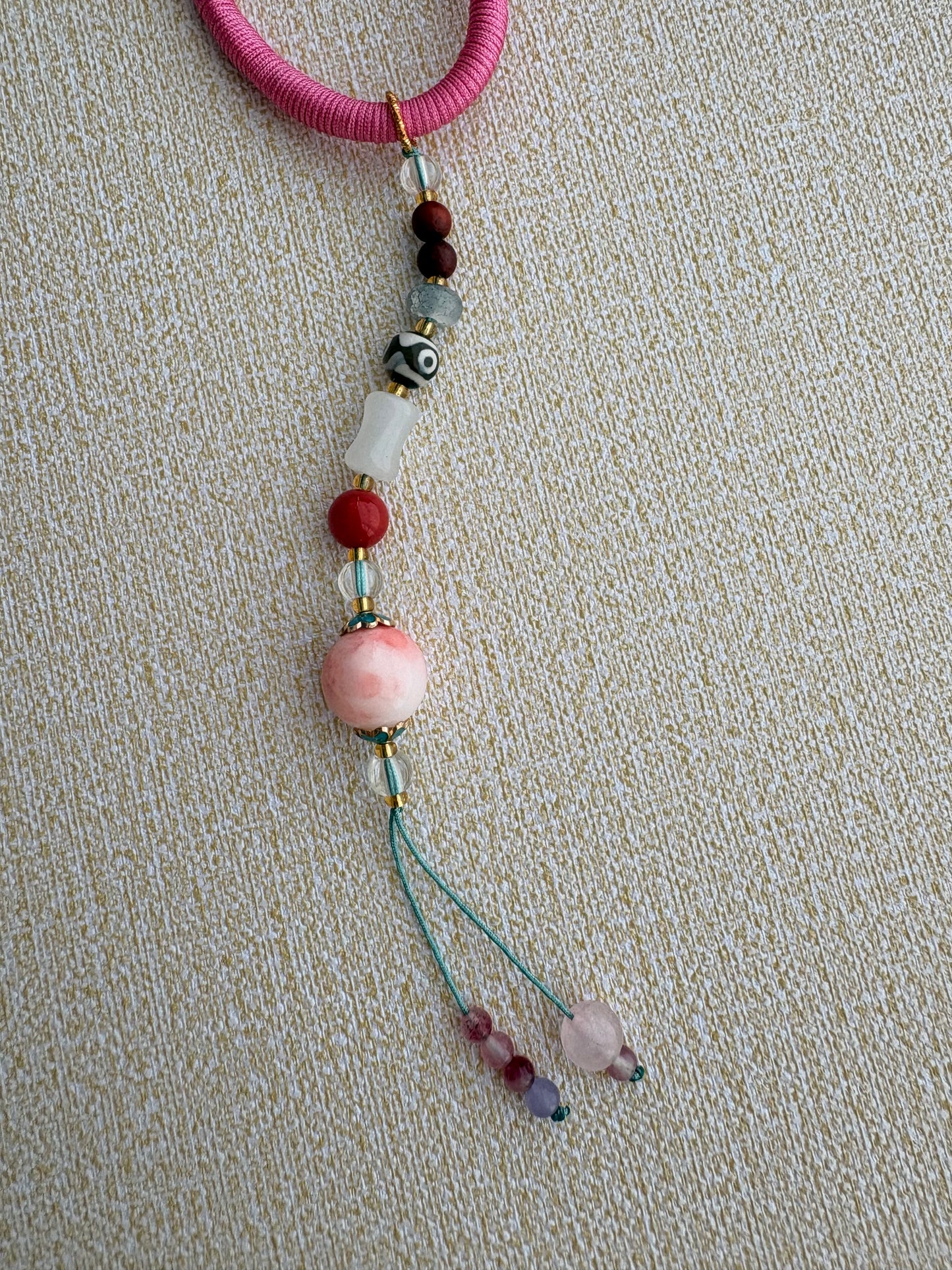 Zaki Lhamo Thangka Charm with Three-Eyed Dzi Bead Tassel in Tibetan Pink