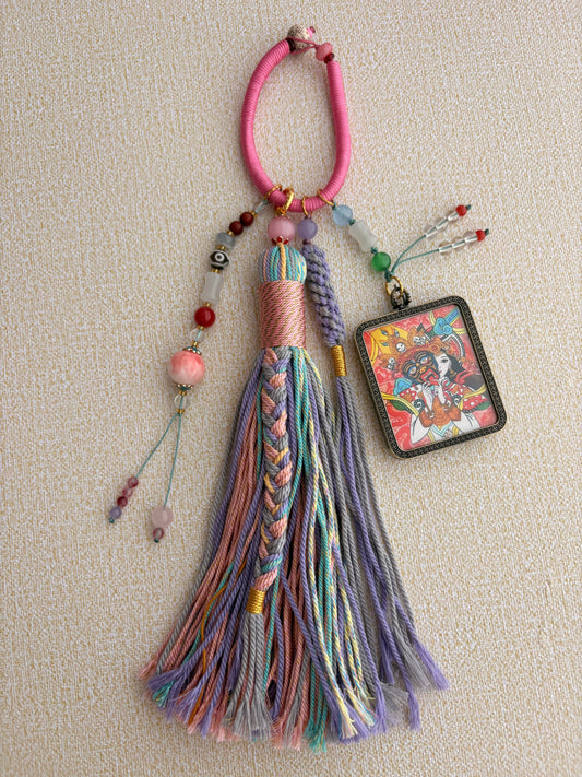 Zaki Lhamo Thangka Charm with Three-Eyed Dzi Bead Tassel in Tibetan Pink